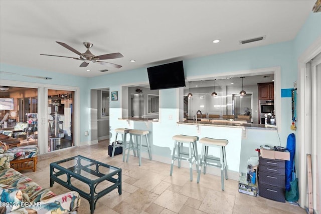 living room featuring ceiling fan