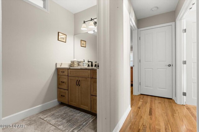 bathroom featuring hardwood / wood-style floors and vanity