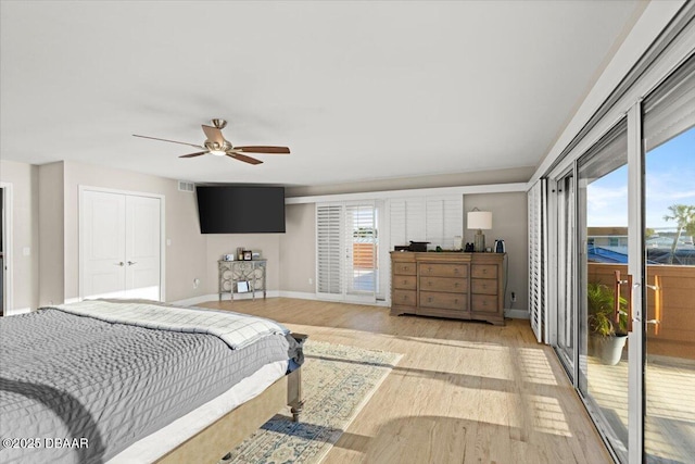 bedroom with ceiling fan, access to exterior, a closet, and light hardwood / wood-style floors