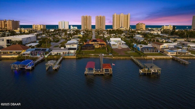 aerial view at dusk with a water view