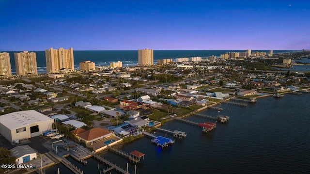 aerial view at dusk with a water view