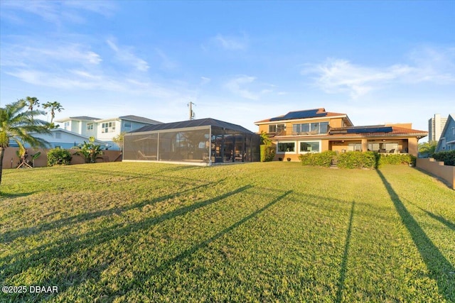 view of yard with glass enclosure