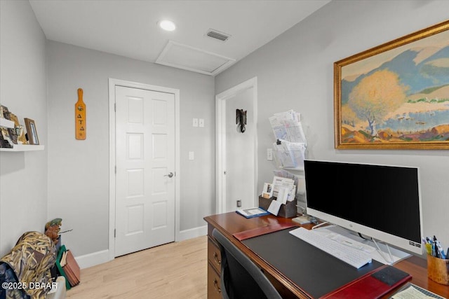 office space with light hardwood / wood-style floors