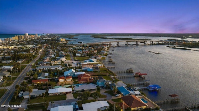 aerial view at dusk with a water view