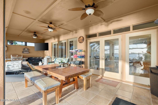 view of patio featuring ceiling fan, a grill, and french doors