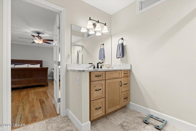 bathroom with ceiling fan, wood-type flooring, vanity, and crown molding