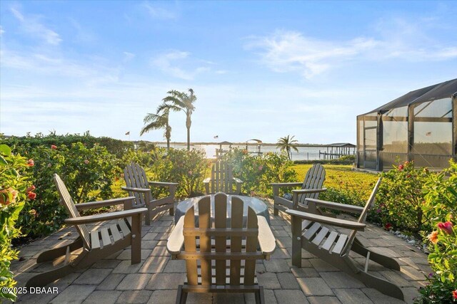 view of patio with glass enclosure