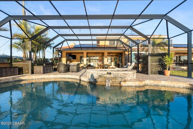 view of pool with a patio area, an in ground hot tub, grilling area, a lanai, and an outdoor hangout area