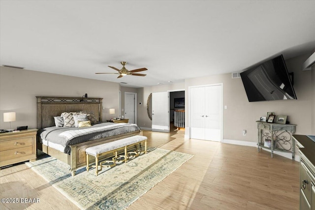 bedroom with ceiling fan and wood-type flooring