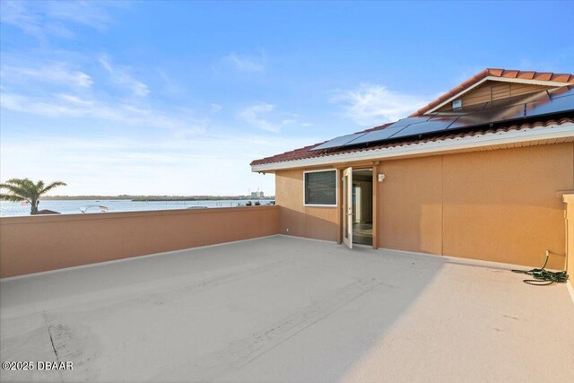 view of patio / terrace featuring a water view