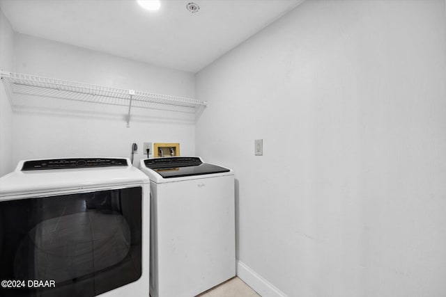 laundry room with separate washer and dryer