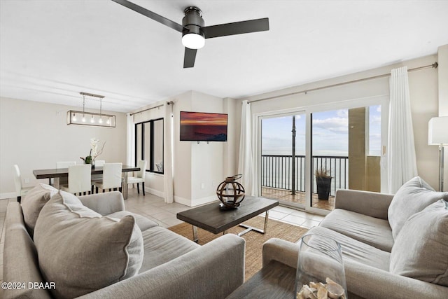 tiled living room with ceiling fan