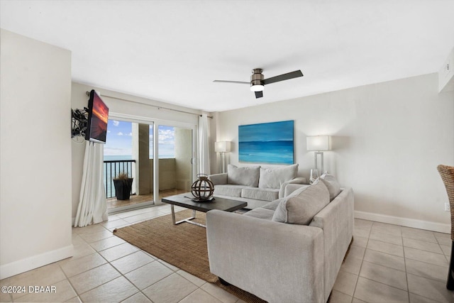 tiled living room with ceiling fan