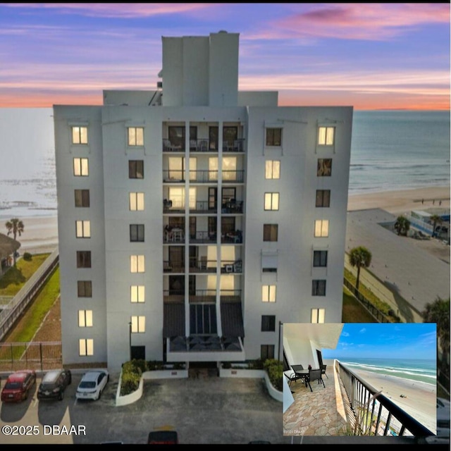 outdoor building at dusk with a water view and a beach view