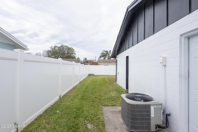 view of yard with central AC unit