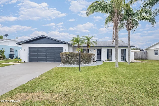 ranch-style home featuring a garage and a front lawn