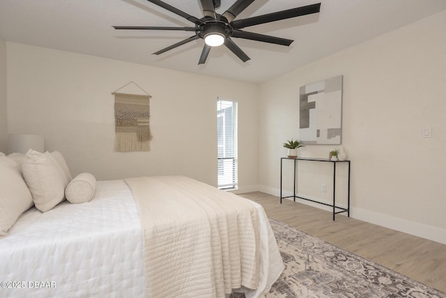 bedroom featuring light hardwood / wood-style flooring and ceiling fan