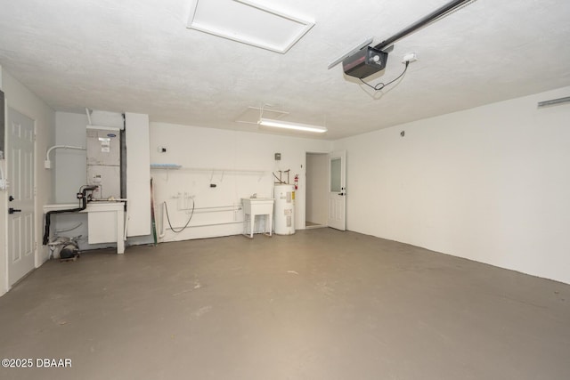 garage featuring a garage door opener and water heater