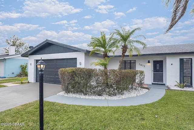 ranch-style home featuring a garage and a front lawn