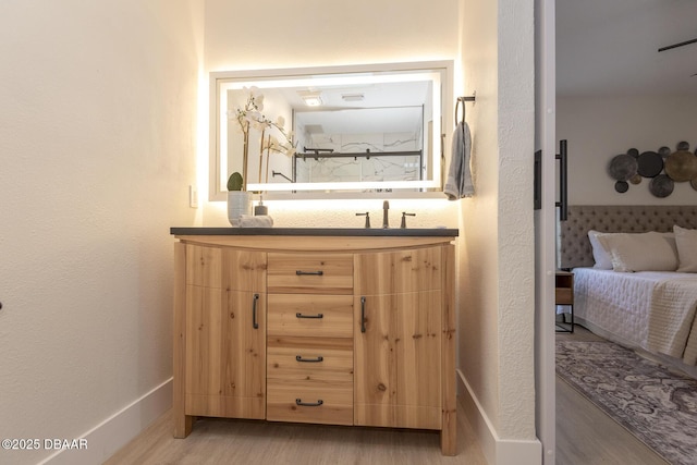 bathroom with wood-type flooring and vanity