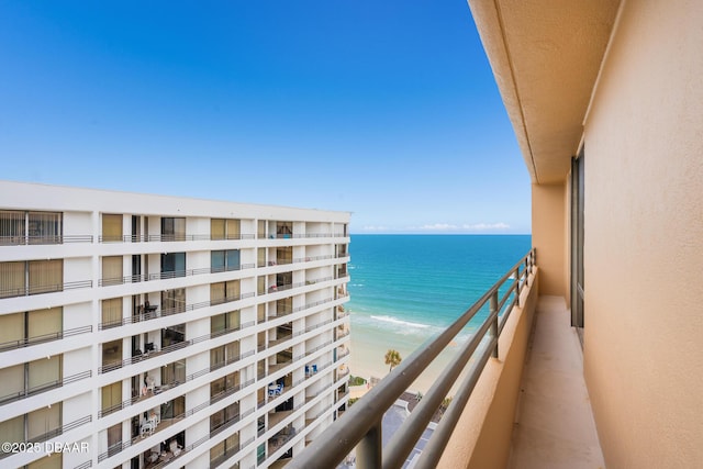 balcony with a view of the beach and a water view