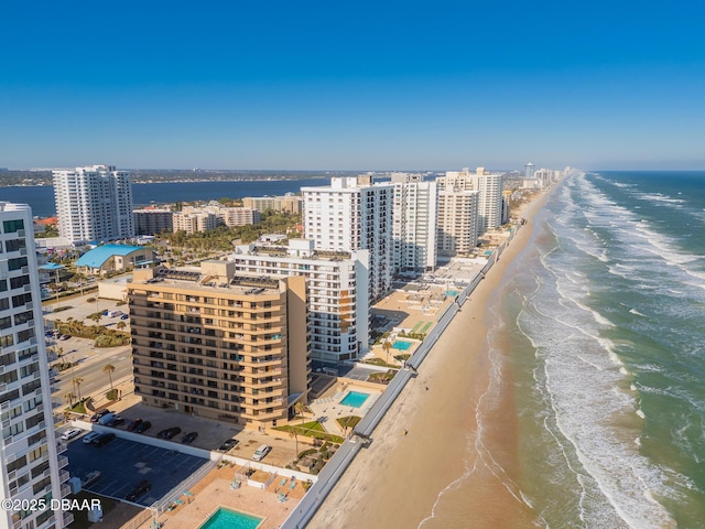 bird's eye view featuring a water view and a view of the beach