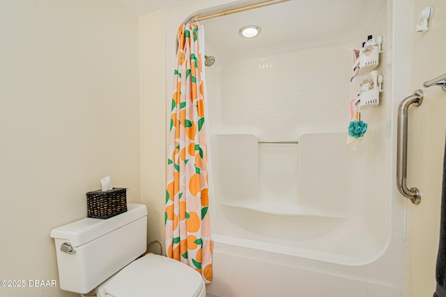 bathroom featuring toilet and shower / bath combo