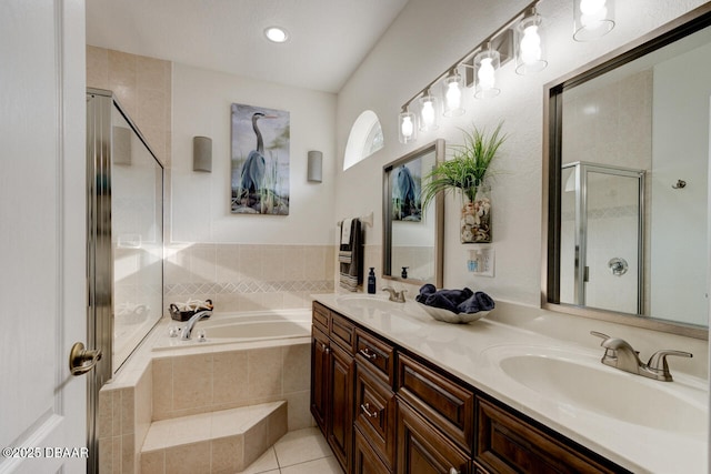 bathroom featuring tile patterned floors, vanity, and separate shower and tub