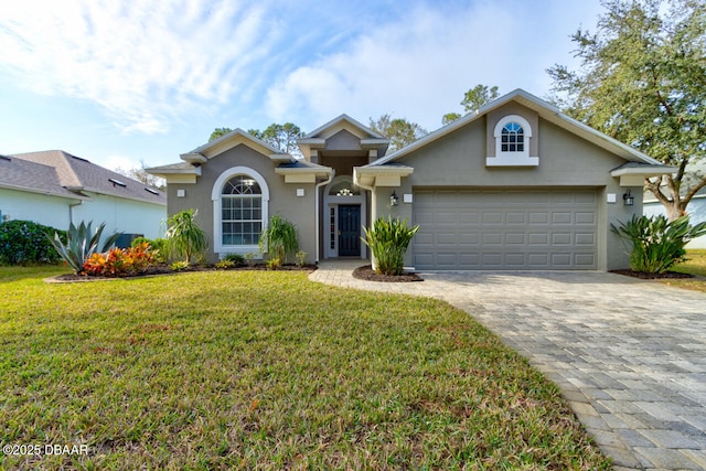 front of property featuring a garage and a front yard