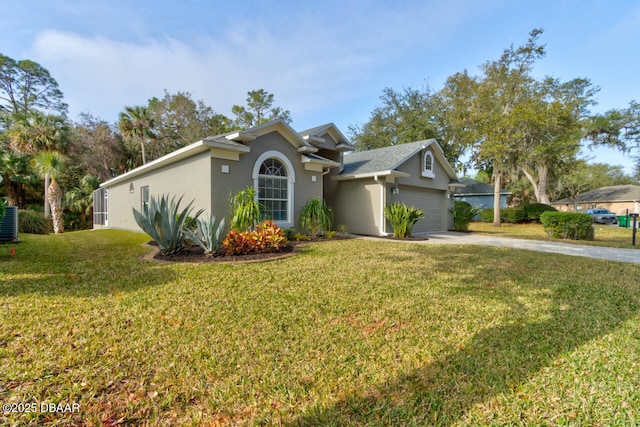 view of front facade with a garage, cooling unit, and a front lawn