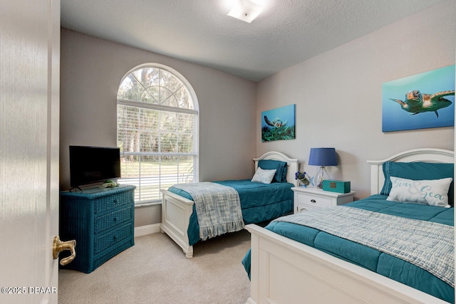 carpeted bedroom with a textured ceiling