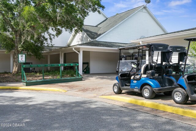 3404 Rexford Cir, Ormond Beach, FL 32174 - view of vehicle parking featuring a carport and driveway