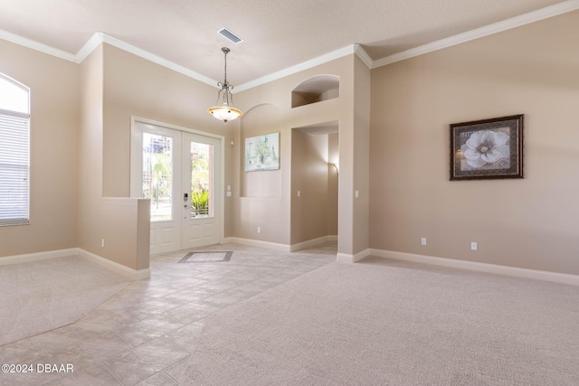 3404 Rexford Cir, Ormond Beach, FL 32174 - entrance foyer with light colored carpet, french doors, crown molding, and baseboards