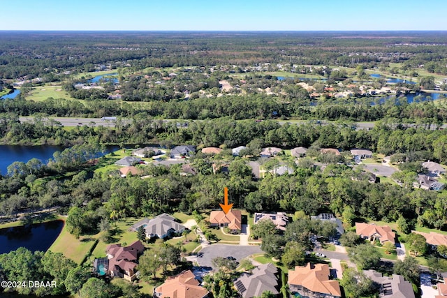 3404 Rexford Cir, Ormond Beach, FL 32174 - aerial view of property and surrounding area with nearby suburban area, a nearby body of water, and a heavily wooded area