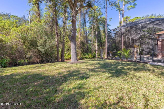 3404 Rexford Cir, Ormond Beach, FL 32174 - view of grassy yard featuring a lanai