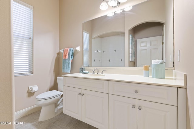 3404 Rexford Cir, Ormond Beach, FL 32174 - bathroom featuring toilet, vanity, tile patterned flooring, a shower, and baseboards