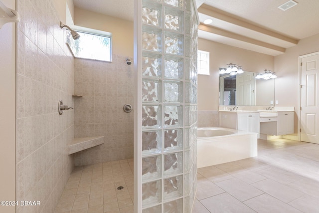 3404 Rexford Cir, Ormond Beach, FL 32174 - bathroom featuring vanity, a walk in shower, a bath, and tile patterned floors