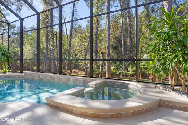 view of pool with an in ground hot tub