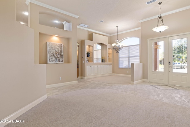 interior space featuring a chandelier and crown molding