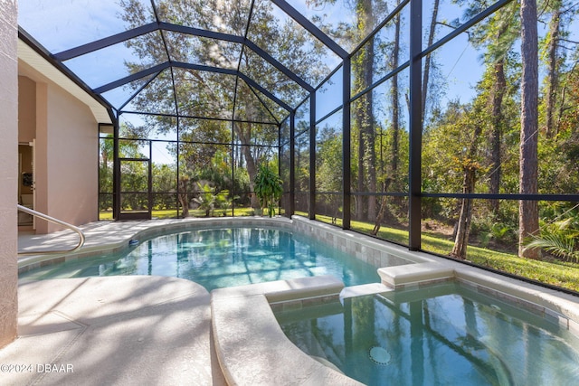 view of swimming pool featuring glass enclosure