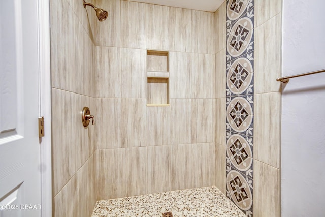 bathroom with tiled shower