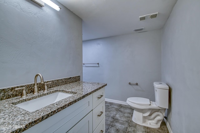 half bath featuring toilet, vanity, visible vents, and tile patterned floors