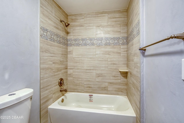 bathroom featuring toilet and washtub / shower combination