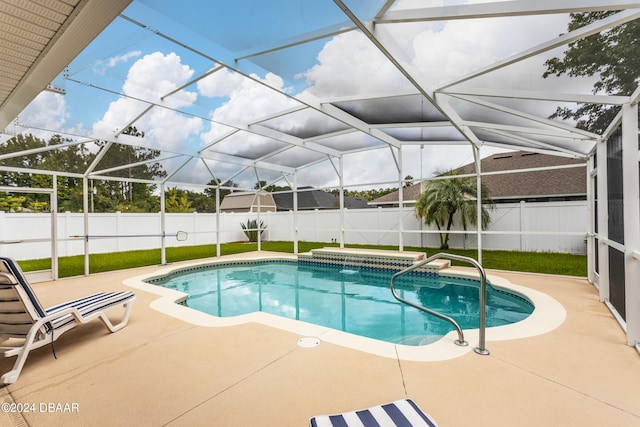 view of pool with a lanai and a patio