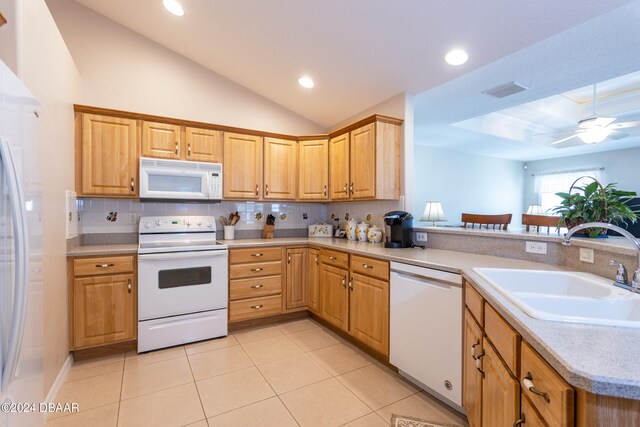 kitchen with kitchen peninsula, white appliances, ceiling fan, and sink