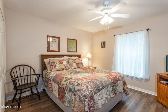 bedroom featuring ceiling fan and dark hardwood / wood-style flooring