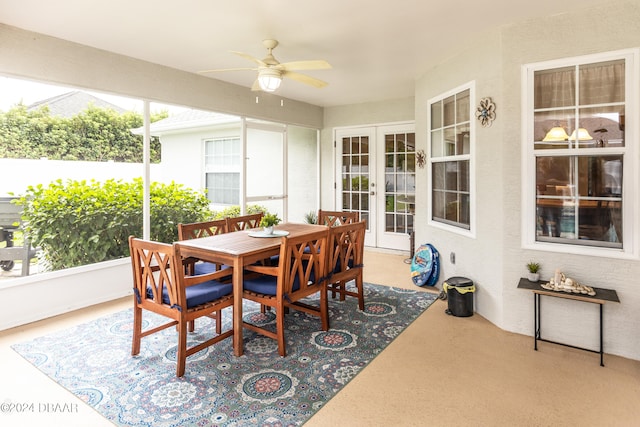 sunroom featuring ceiling fan and french doors