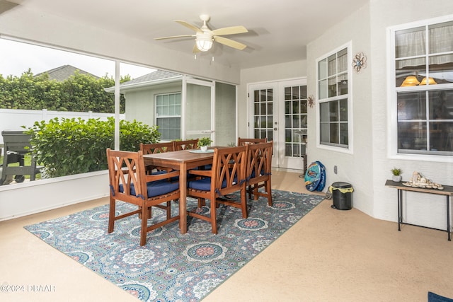 sunroom / solarium with french doors and ceiling fan