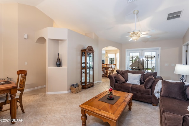 living room featuring light tile patterned floors, ceiling fan, and lofted ceiling