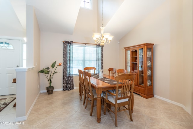 tiled dining space with high vaulted ceiling and a notable chandelier